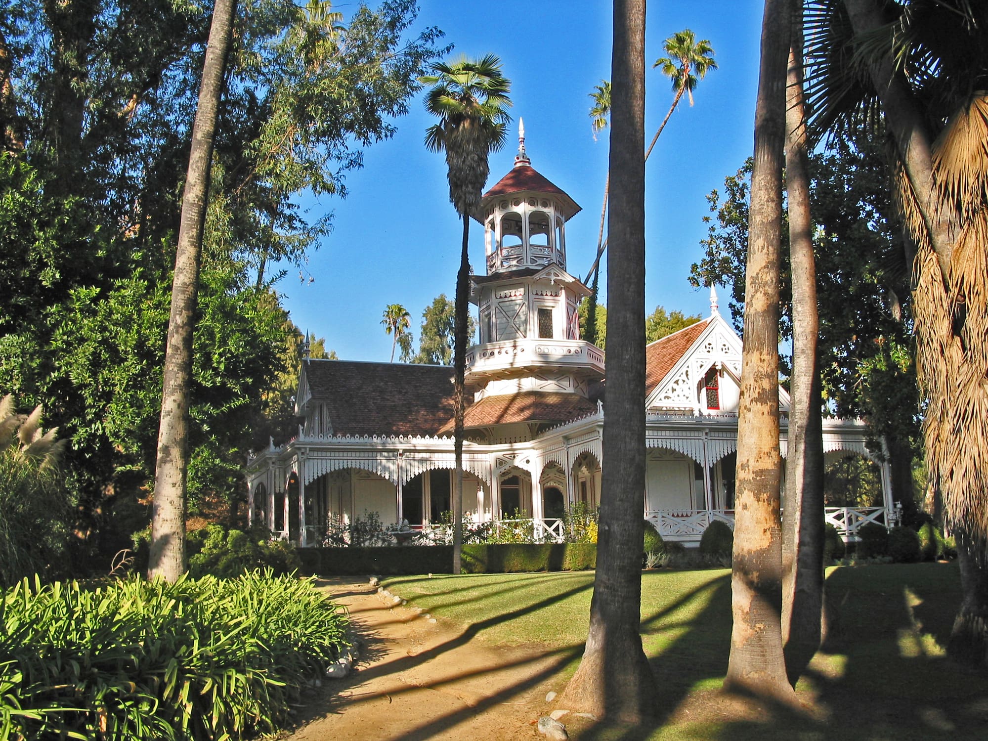 Front lawn view of Victorian styled Queen Anne Cottage as seen at the Los Angeles County Arboretum and Botanical Gardens in Arcadia, California.